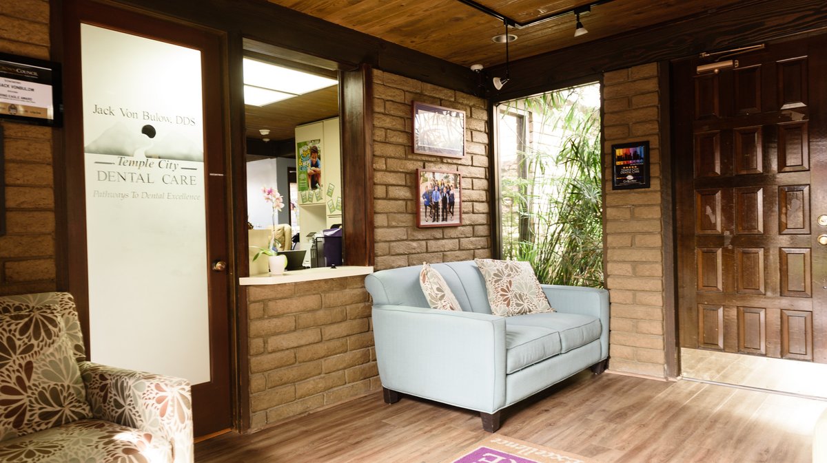 the interior of the Temple City Dental Care with a white couch