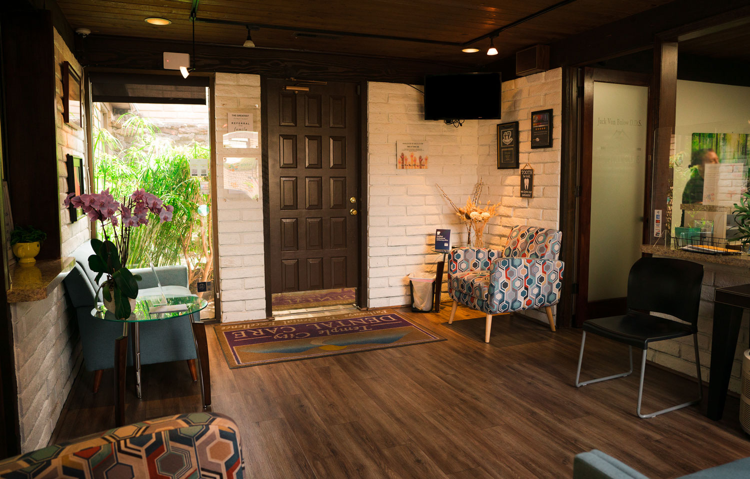 Lobby area of Temple City Dental with front door.