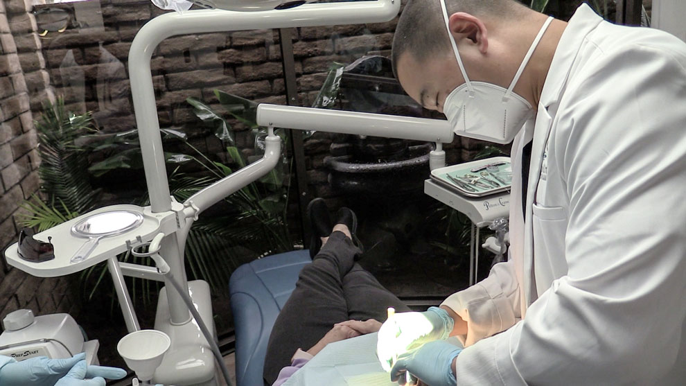 Dr. Kyle Low working on a patient.